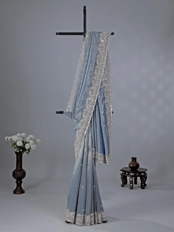Pastel blue tissue silk saree with classic sequins work