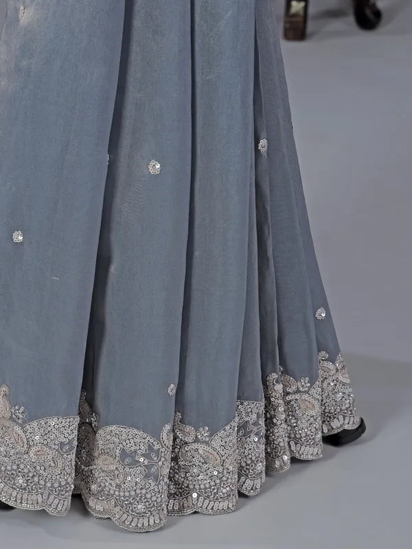 Pastel blue tissue silk saree with classic sequins work