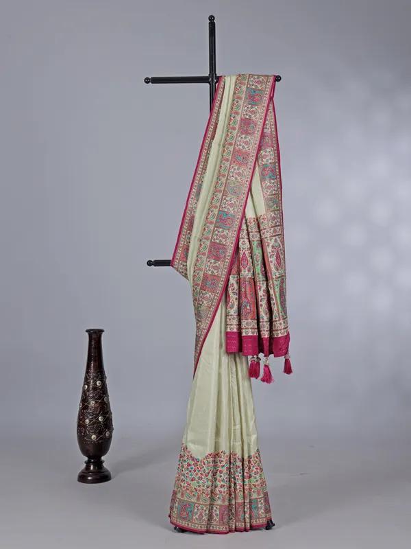 Pastel cream pashmina silk saree with artistic borders