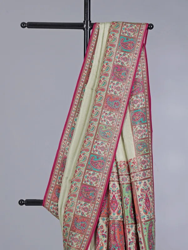Pastel cream pashmina silk saree with artistic borders