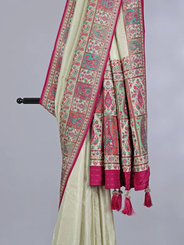 Pastel cream pashmina silk saree with artistic borders