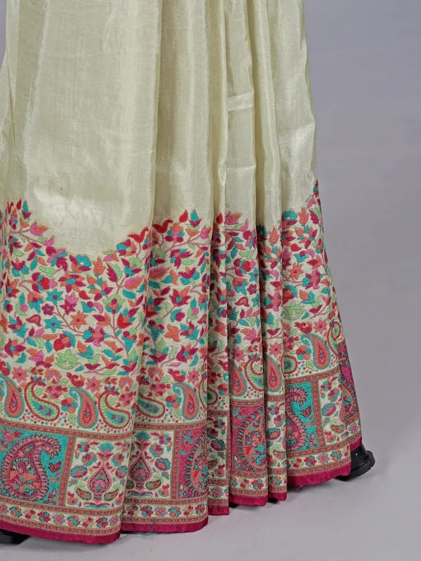 Pastel cream pashmina silk saree with artistic borders