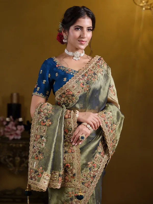 Pastel green organza saree with zardosi embroidery