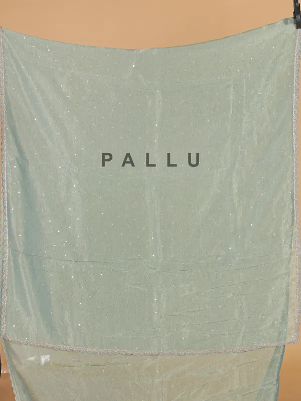 Pastel green organza wedding wear saree