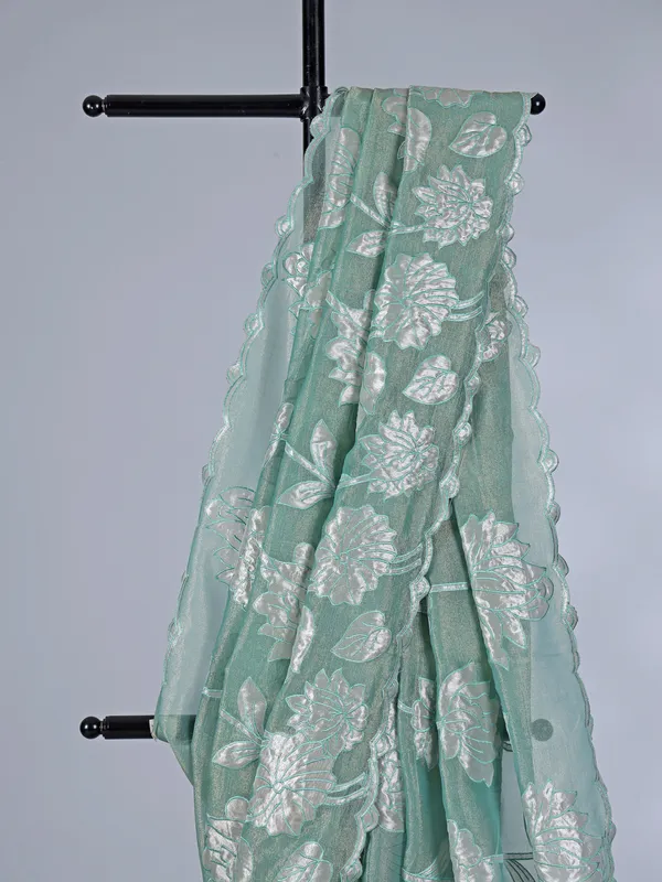Pastel green semi tissue silk saree with elegant zari work