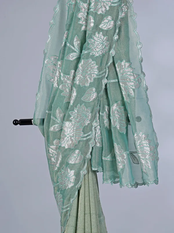 Pastel green semi tissue silk saree with elegant zari work