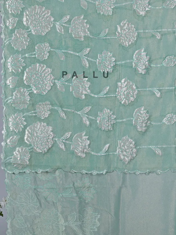 Pastel green semi tissue silk saree with elegant zari work
