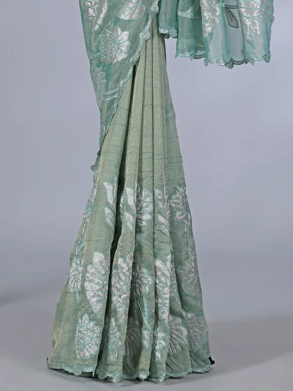 Pastel green semi tissue silk saree with elegant zari work