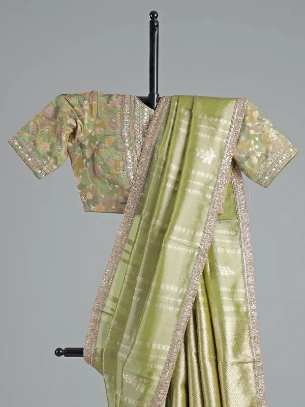 Pastel green soft tissue saree with sequin shine