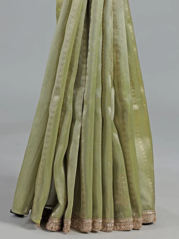 Pastel green soft tissue saree with sequin shine