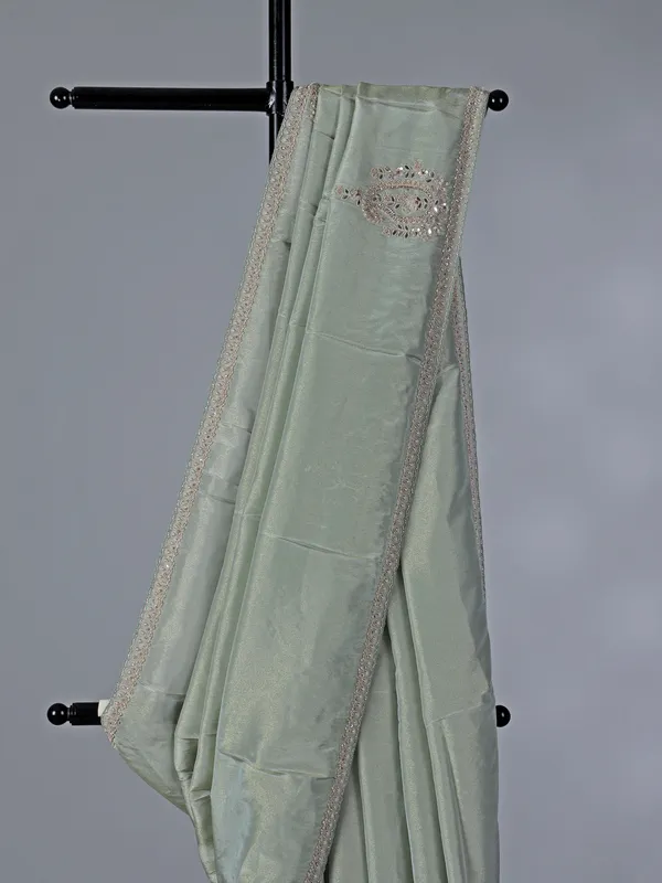 Pastel green tissue dola silk saree with zardosi accents