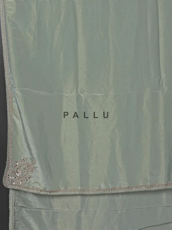 Pastel green tissue dola silk saree with zardosi accents
