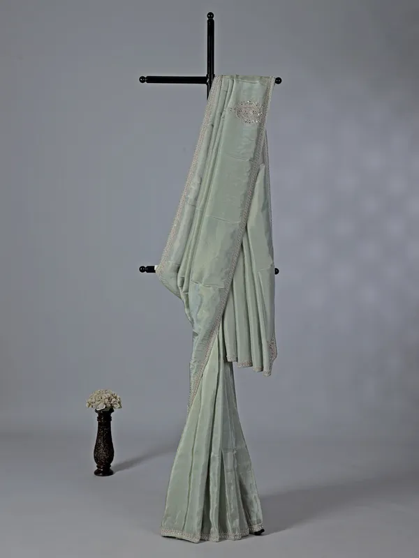 Pastel green tissue dola silk saree with zardosi accents