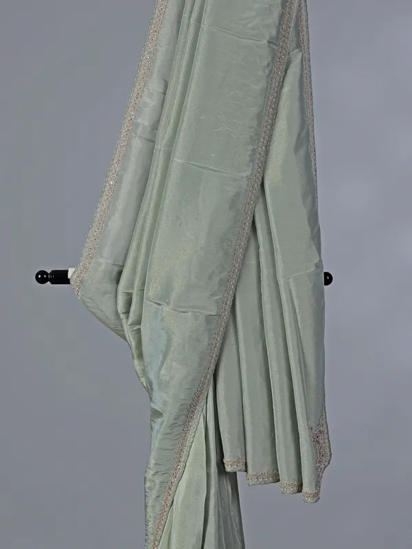 Pastel green tissue dola silk saree with zardosi accents