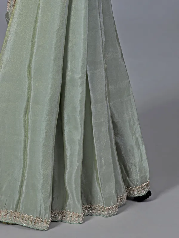 Pastel green tissue dola silk saree with zardosi accents
