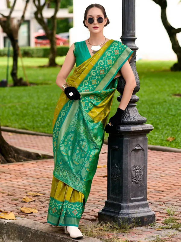 Pastel olive saree with contrast border