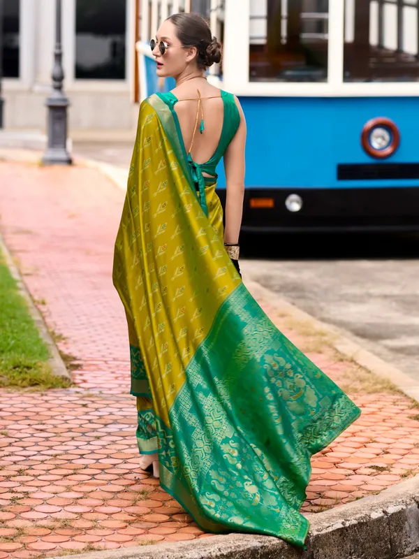 Pastel olive saree with contrast border