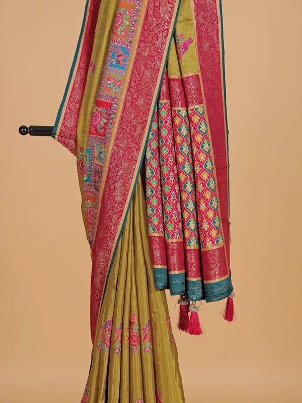 Pastel olive silk saree with zari weaving