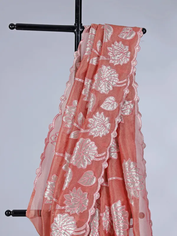 Pastel orange semi tissue silk saree with zari design