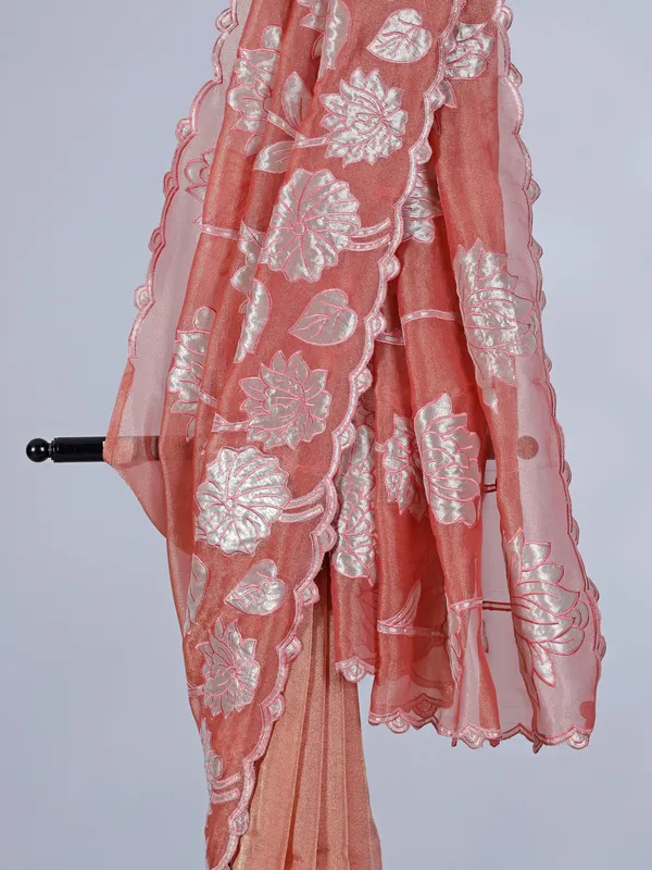Pastel orange semi tissue silk saree with zari design