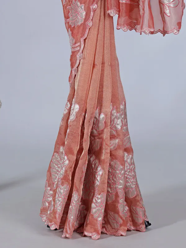 Pastel orange semi tissue silk saree with zari design