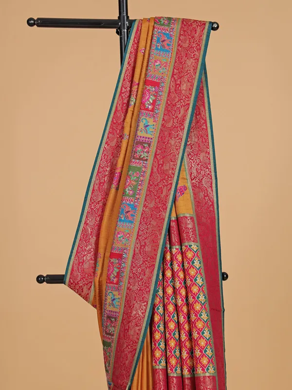 Pastel orange silk festive wear saree