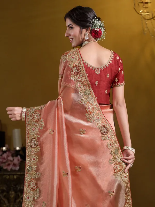 Pastel orange tissue silk saree for weddings
