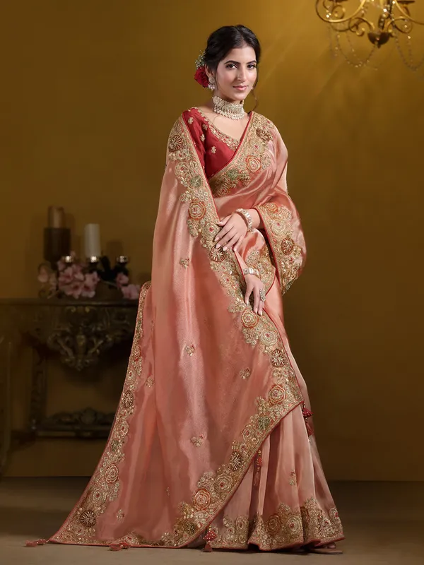 Pastel orange tissue silk saree for weddings