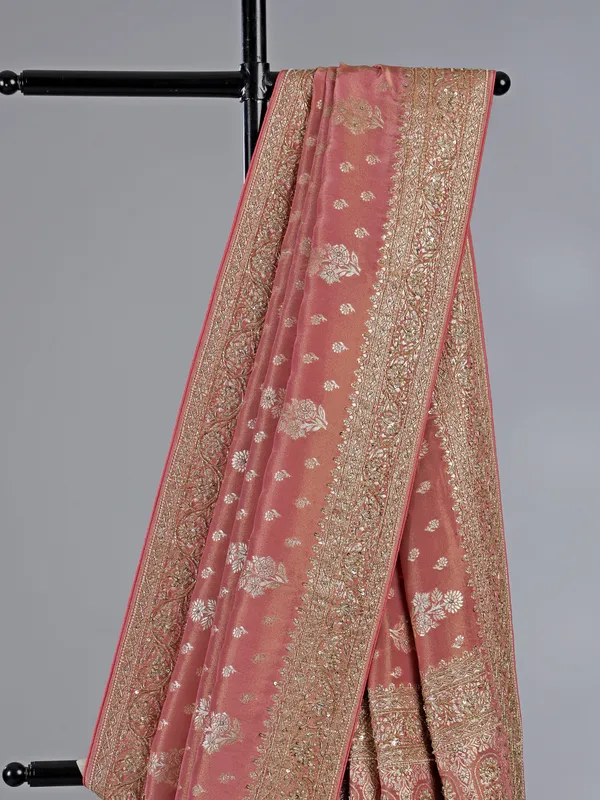 Pastel peach dola silk unstitched saree with festive detailing