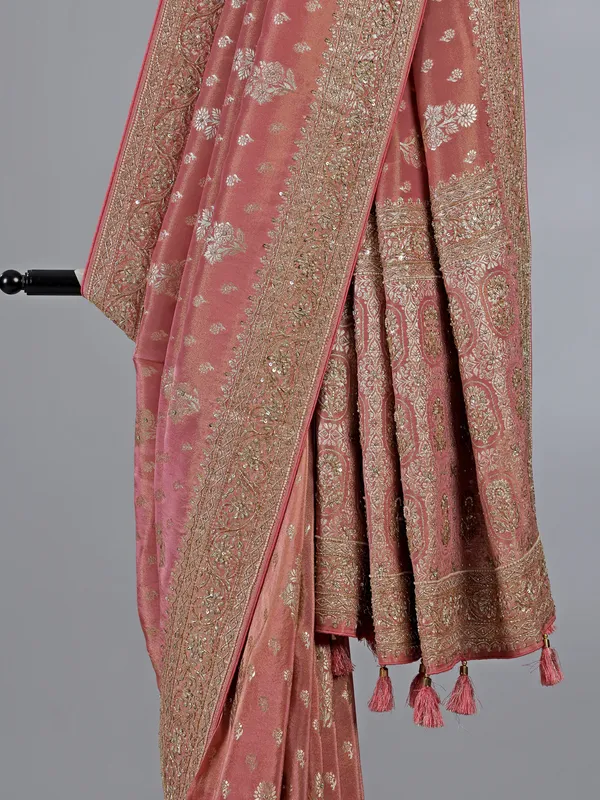 Pastel peach dola silk unstitched saree with festive detailing