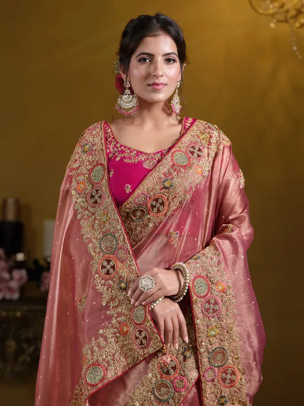 Pastel peach organza saree with zardosi work