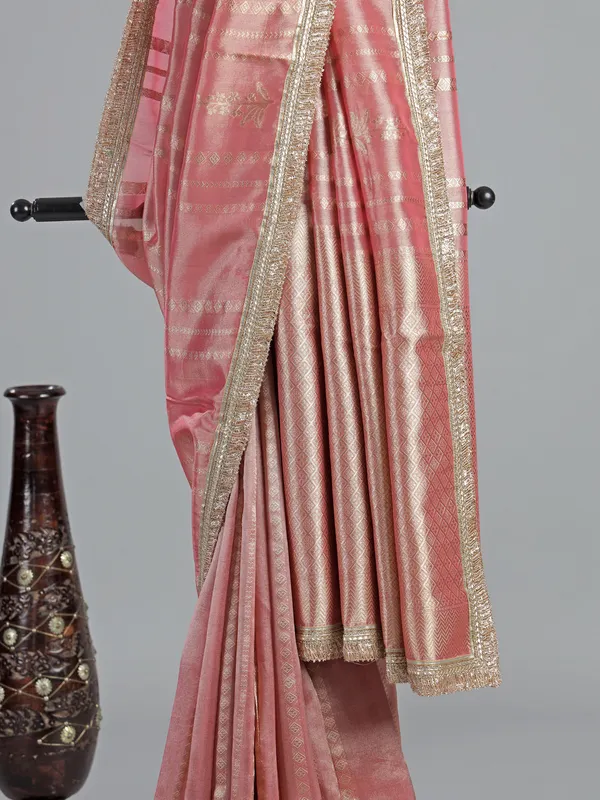 Pastel peach soft tissue saree with beaded elegance