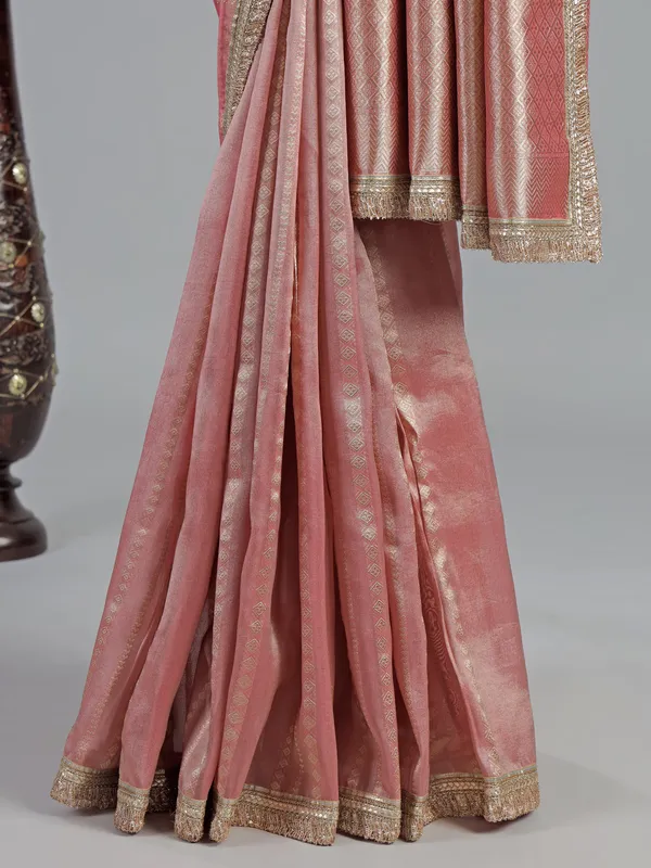 Pastel peach soft tissue saree with beaded elegance