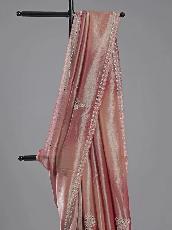 Pastel pink tissue silk saree with designer charm