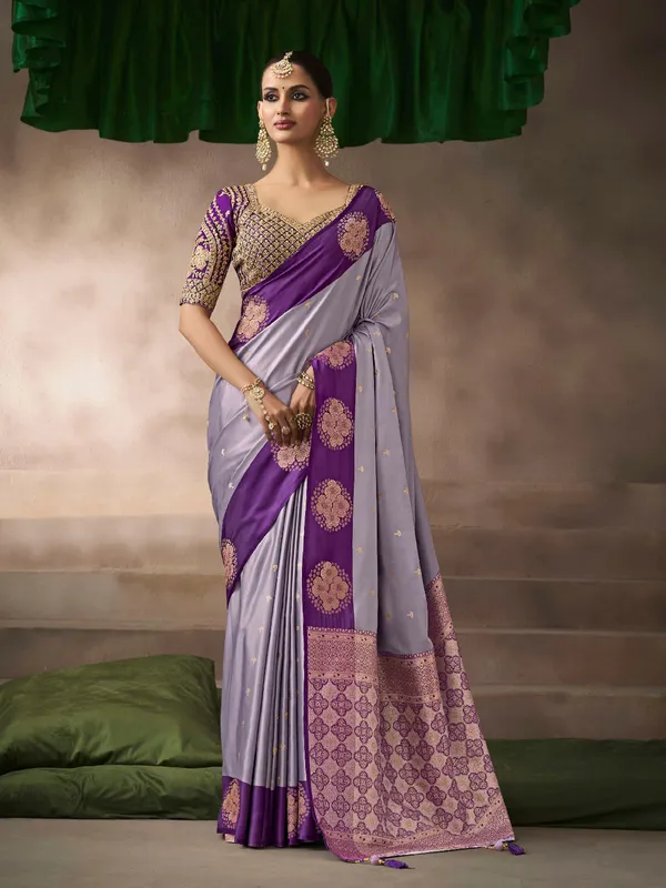 Pastel purple satin silk saree with graceful zari