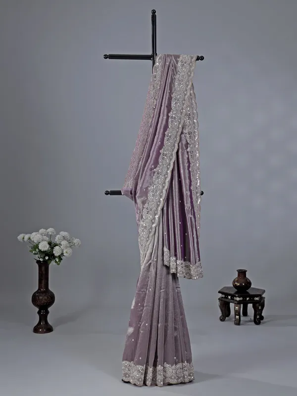 Pastel purple tissue silk saree with heavy work
