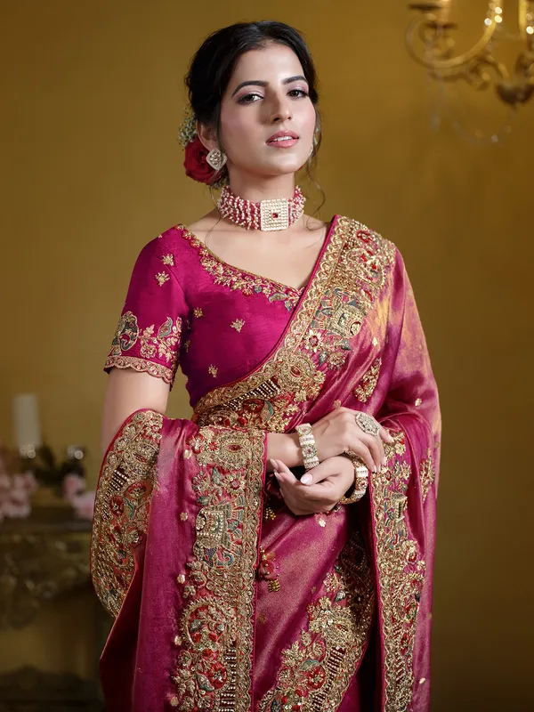 Pastel rani organza saree with zardosi work