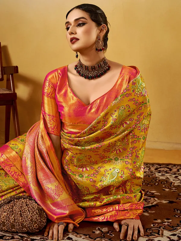 Pastel yellow festive silk saree with zari detail