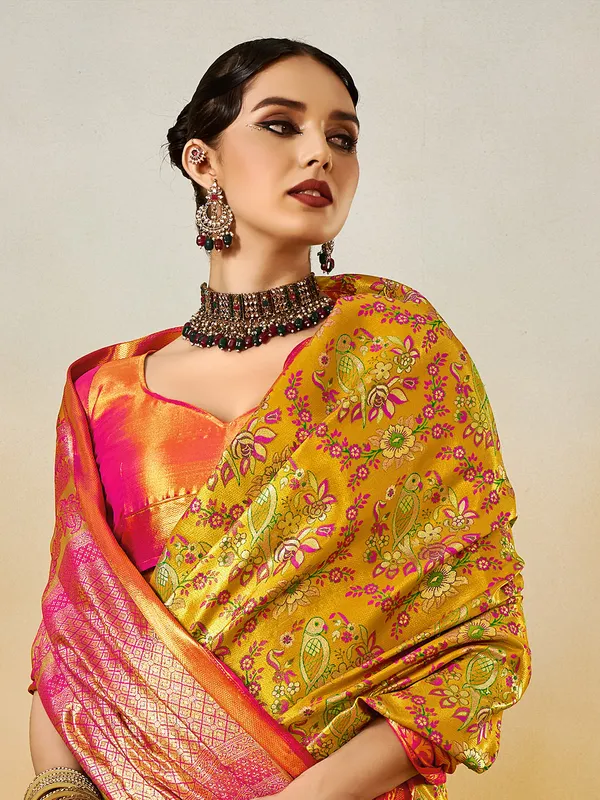 Pastel yellow festive silk saree with zari detail