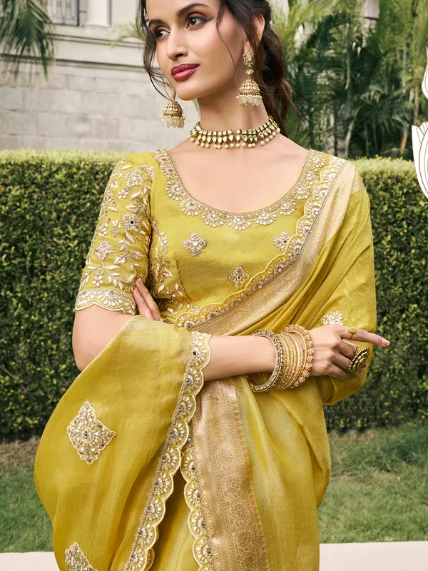 Pastel yellow tissue silk saree for bridal radiance