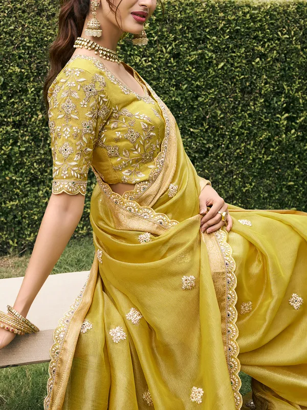 Pastel yellow tissue silk saree for bridal radiance