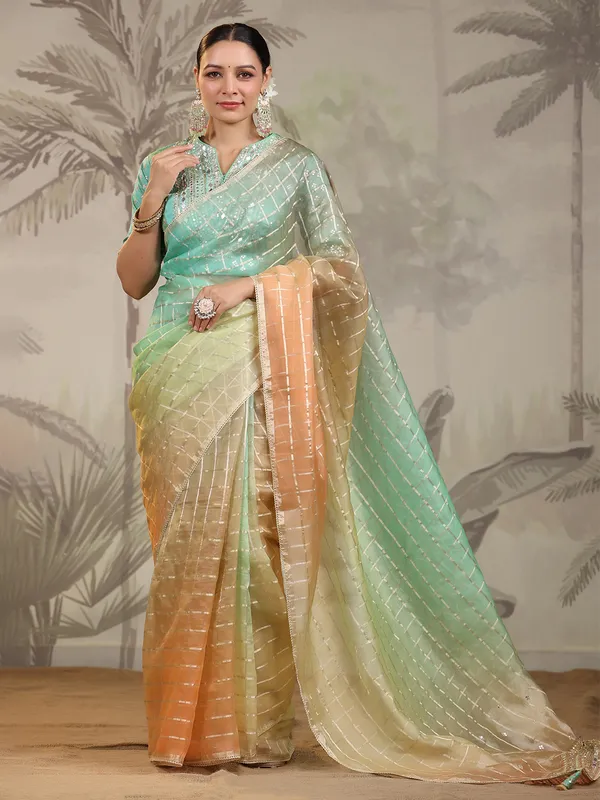 Peach and green organza saree
