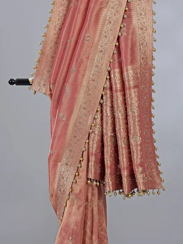 Peach dola tissue silk wedding wear saree with zari weaving