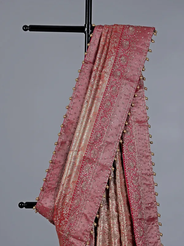 Peach kanjivaram silk saree with regal zardosi craft
