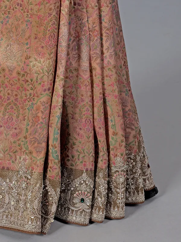 Peach kanjivaram with colorful motifs saree