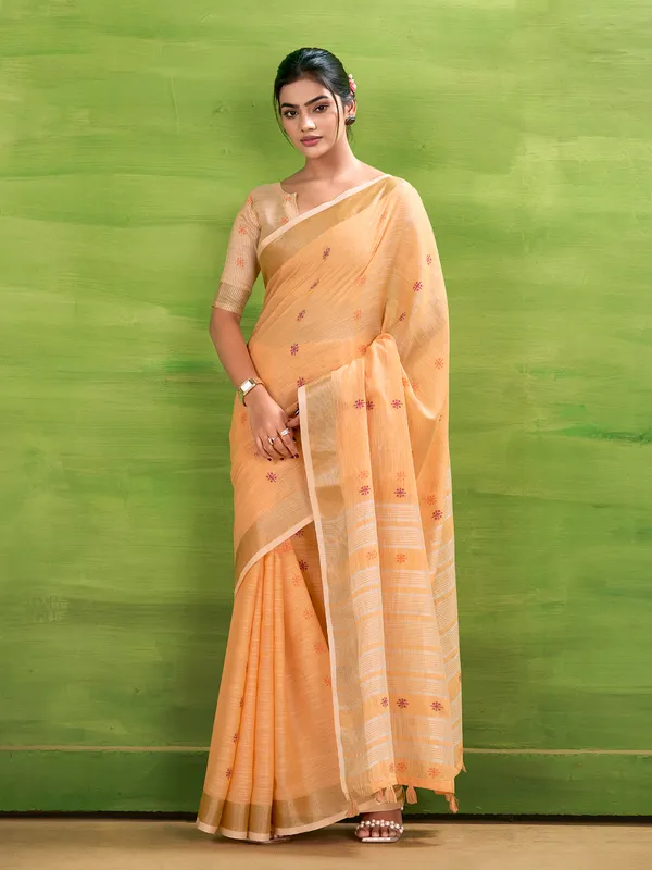 Peach linen silk saree with festive charm