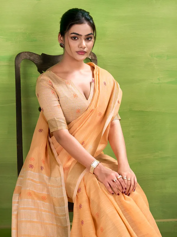 Peach linen silk saree with festive charm