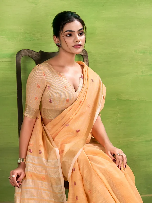 Peach linen silk saree with festive charm