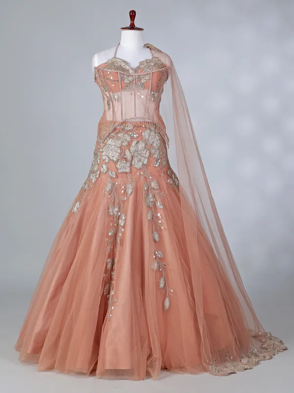 Peach net lehenga choli with attached dupatta