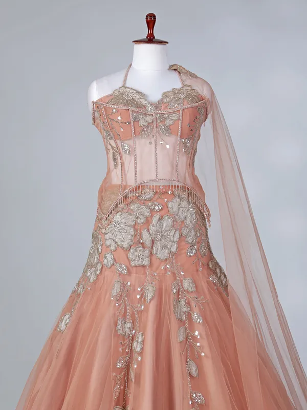 Peach net lehenga choli with attached dupatta